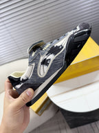 Fendi unisex sneaker close-up, dark fabric with white speckled swoosh-style logo