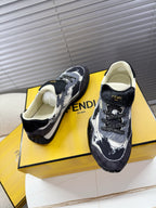 Fendi unisex sneakers, front view with dark and white speckled panels, lace-up