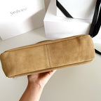 Tan suede tote bag, side view, with structured top and stitched trim