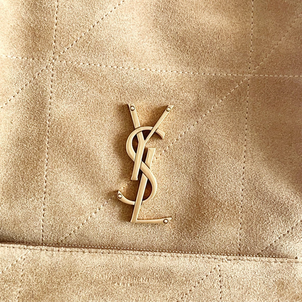 YSL logo hardware on tan suede tote bag front panel