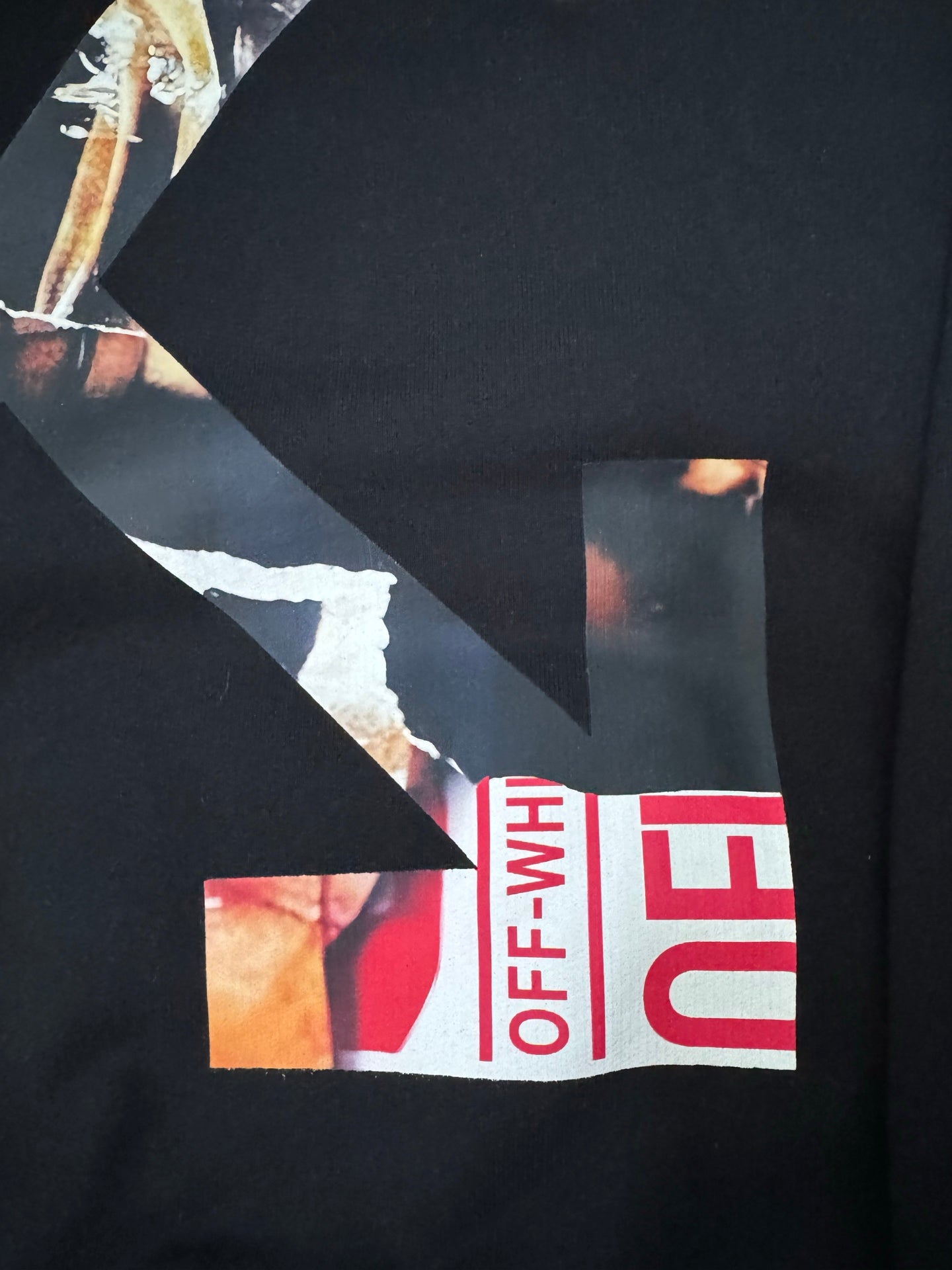 Black hoodie back print detail with red Off-White text blocks and geometric shapes