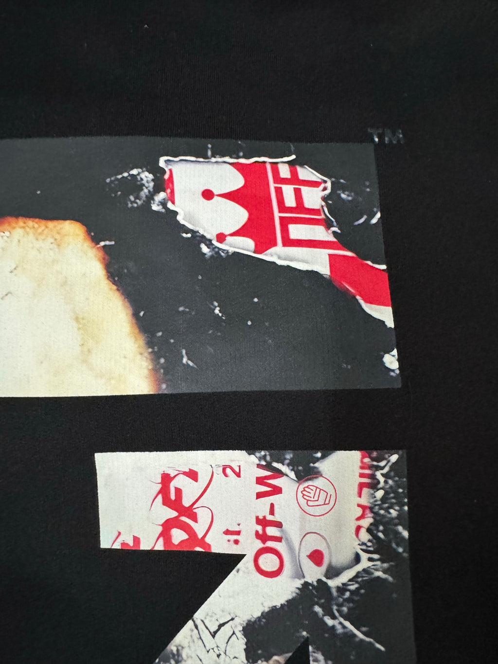 Black hoodie back print detail with red graphic blocks and Off-White text