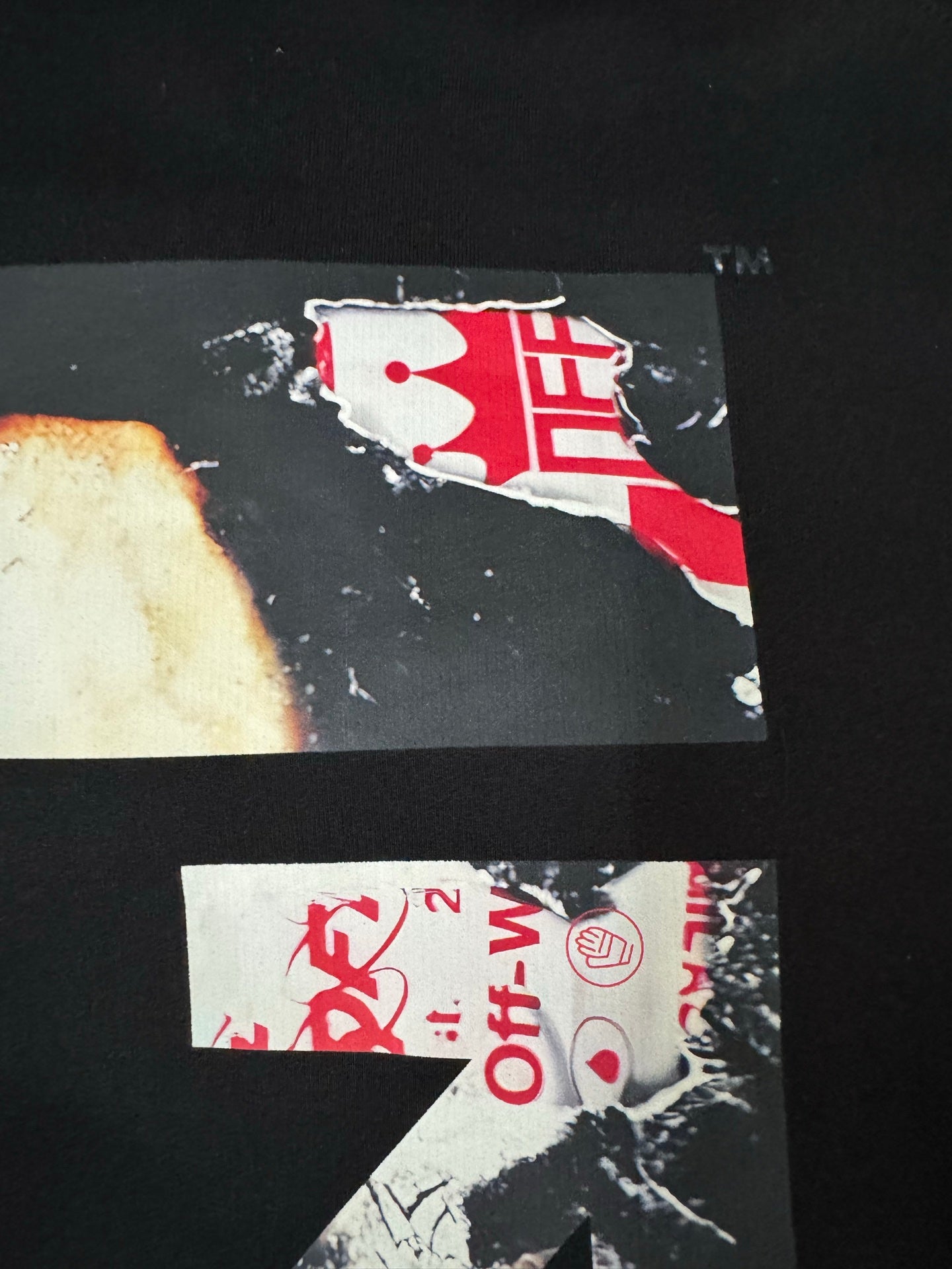 Black hoodie back print detail with red graphic blocks and Off-White text