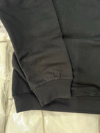 Black hoodie sleeve cuff with ribbed hem and side seam stitching