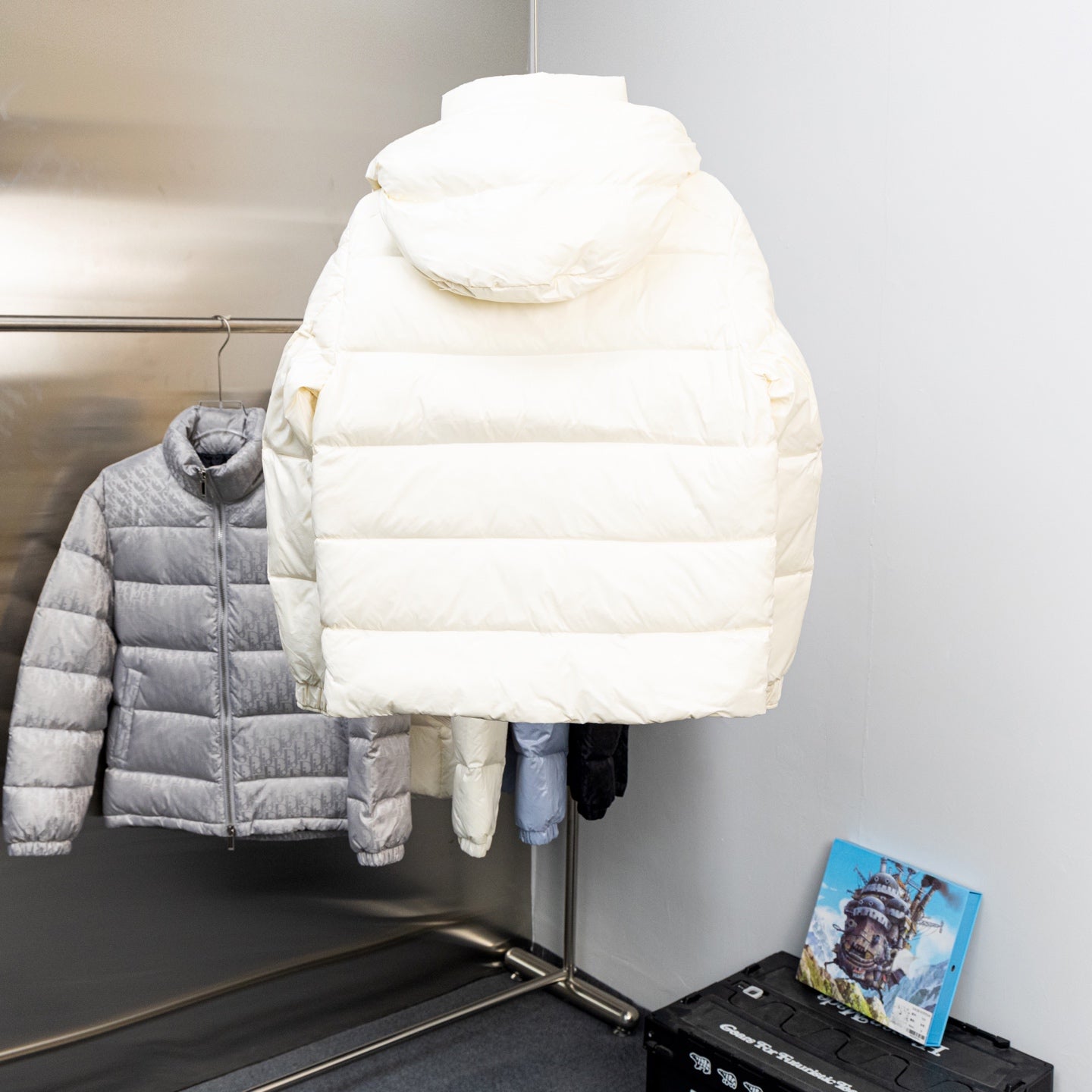 Moncler long puffer jacket in white, back view with attached hood