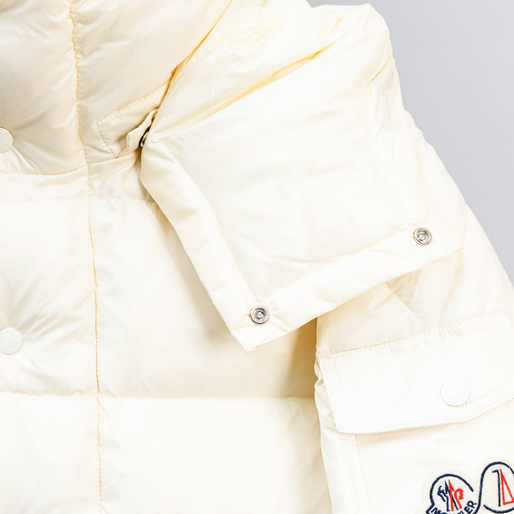 Moncler white puffer jacket sleeve detail with snap cuff and stitching