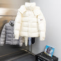 Moncler long puffer jacket in white with hood and front button closure