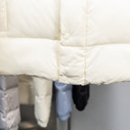 Moncler long padded coat front, off-white, snap-button placket and quilted panels