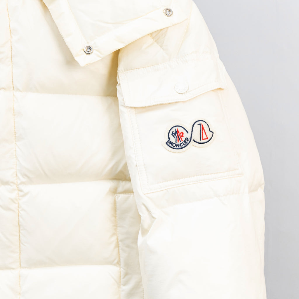 Moncler white puffer jacket with logo patches on the upper sleeve