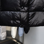 Long puffer jacket front with snap buttons and padded quilting