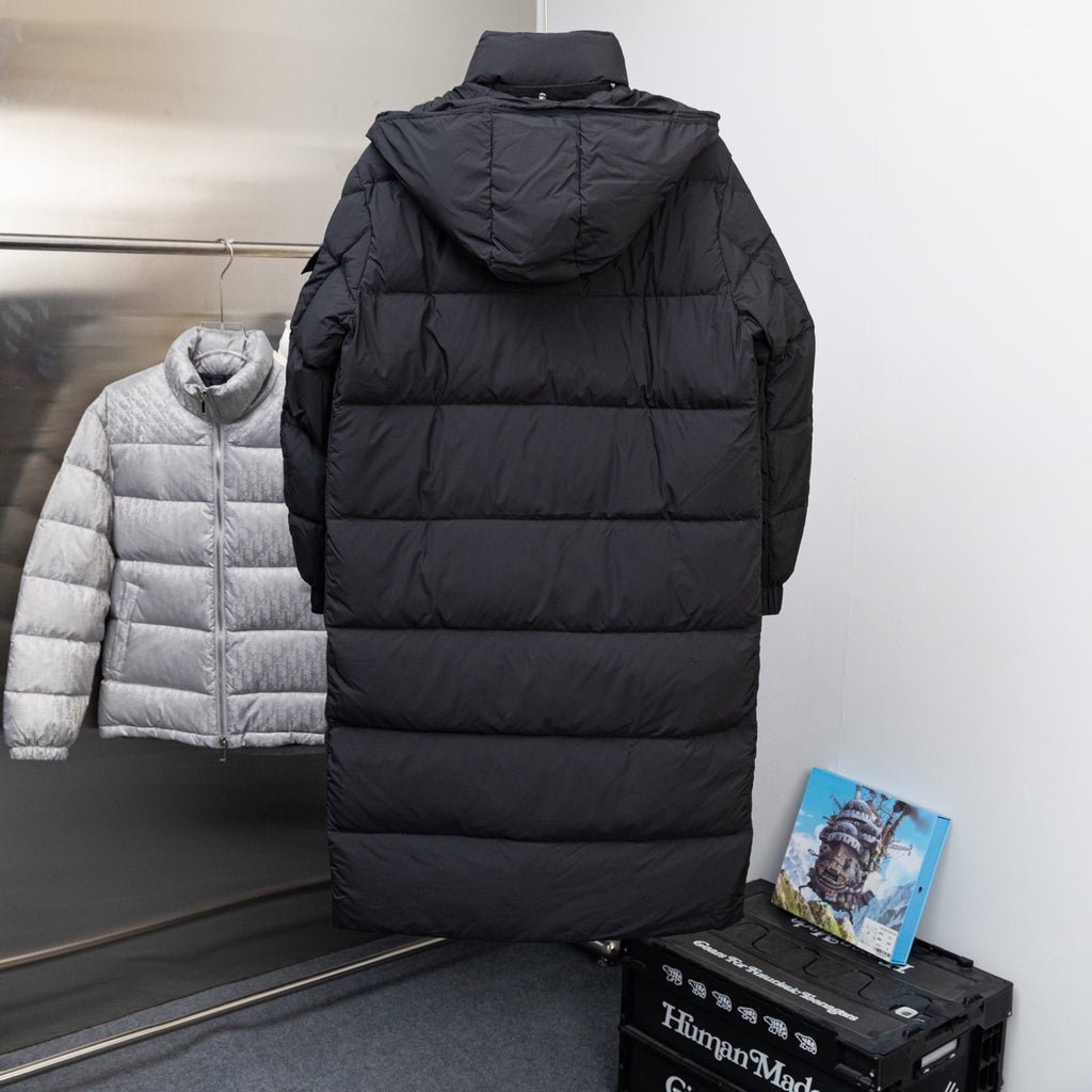 Moncler long black puffer coat, rear view, hooded with quilted panels