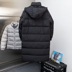 Moncler long black puffer coat, rear view, hooded with quilted panels