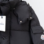 Moncler black puffer coat shoulder with press-stud tabs and logo patch