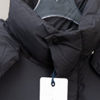 Moncler black puffer coat collar with snap button and inner hood fabric