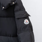 Moncler black puffer coat sleeve with round logo patch and snap cuff