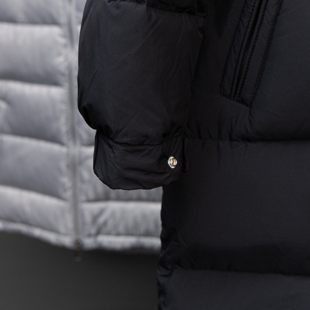Black long puffer jacket cuff with snap button and dark zipper