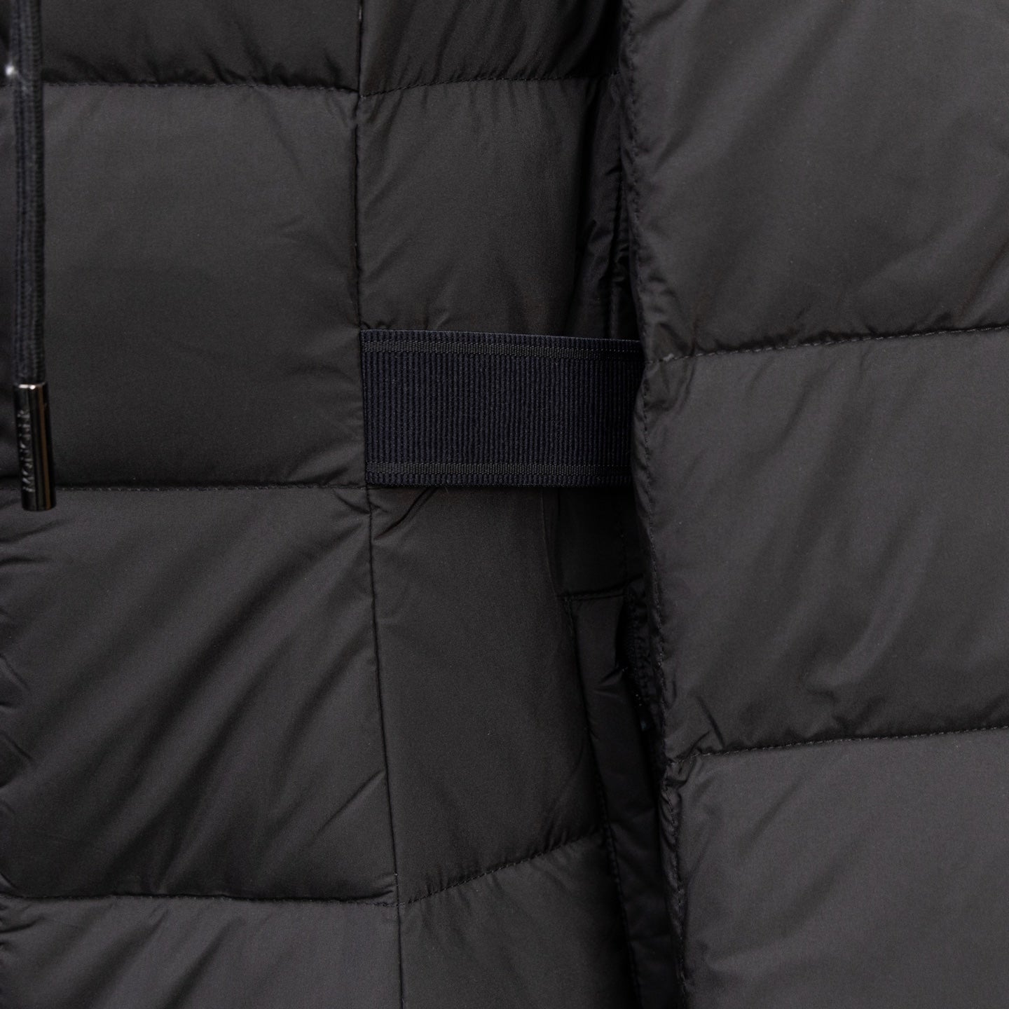 Moncler long puffer coat, black, side elastic strap detail and quilted paneling