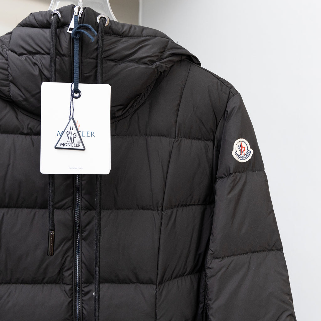 Black puffer jacket with full-zip front and Moncler sleeve logo patch