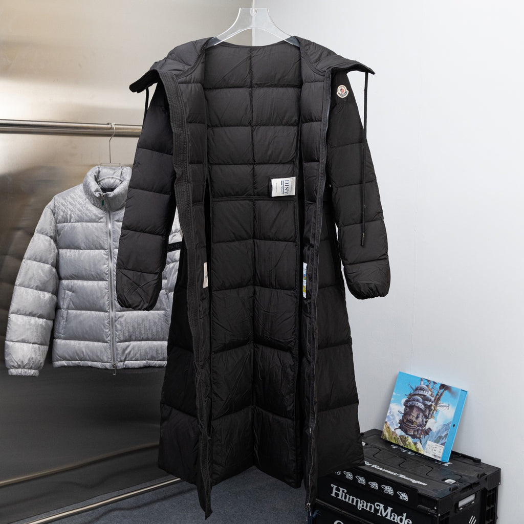 Long Moncler puffer coat in black with hood and zip-front, side tie tabs
