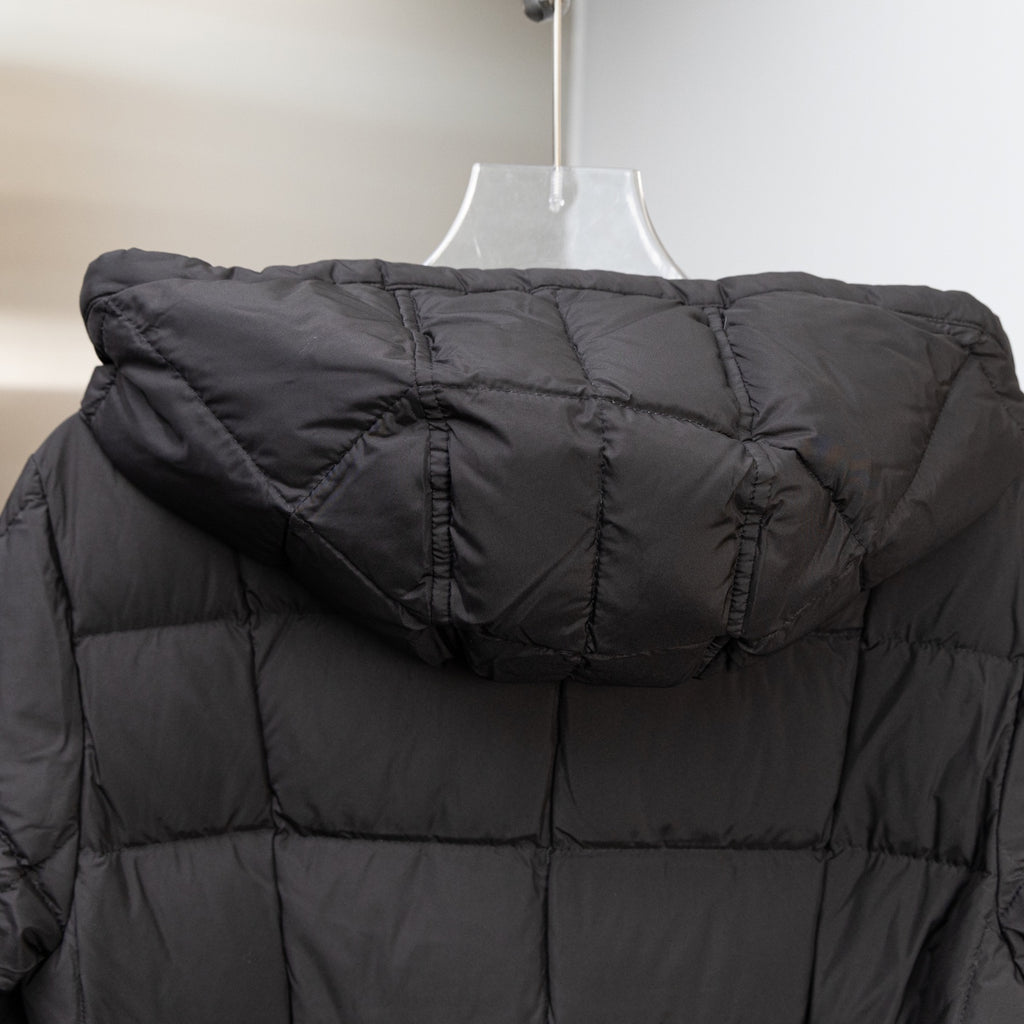Black long puffer coat with attached hood and quilted baffles