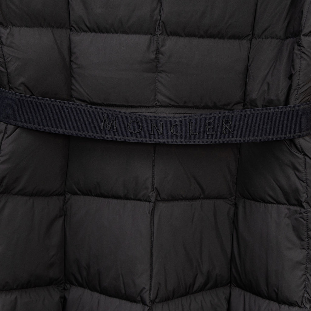 Black puffer coat midsection with embossed Moncler waistband text