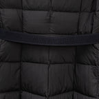Black puffer coat midsection with embossed Moncler waistband text