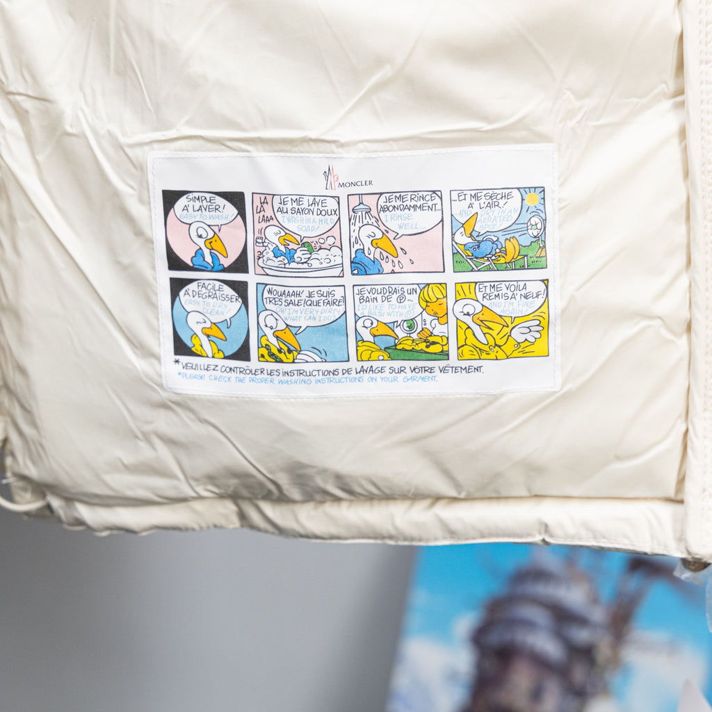 Long puffer jacket with interior care label pocket