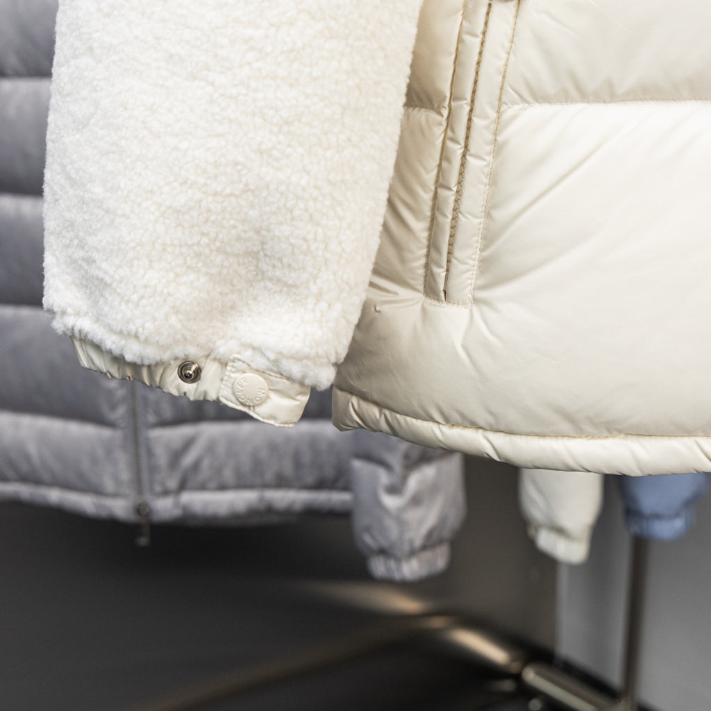 Long puffer jacket with sherpa cuff and snap buttons
