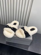 Balenciaga plush slide sandals on box, cream fuzzy straps with black buckle hardware