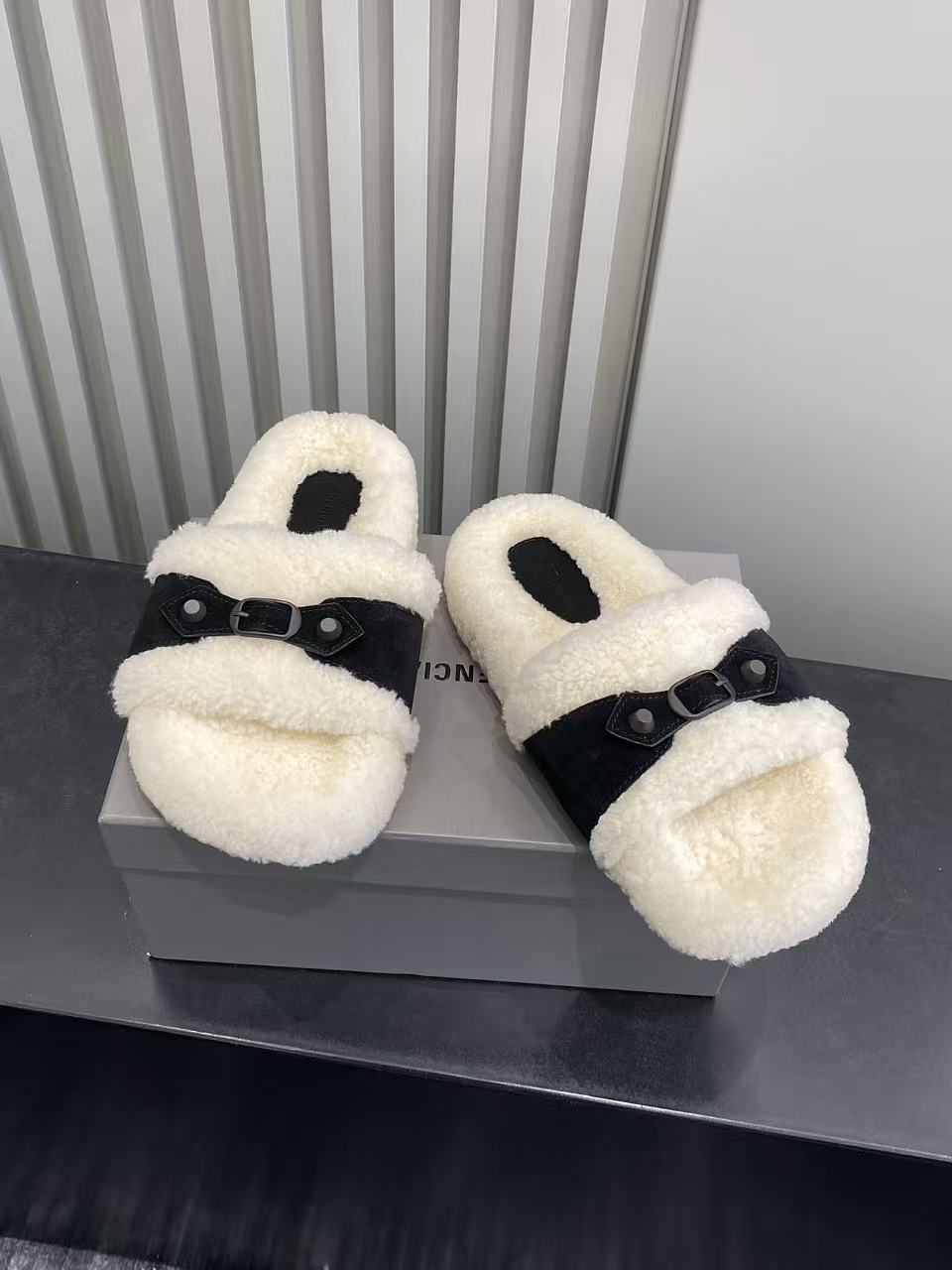Balenciaga plush slide sandals with black strap and cream teddy-texture upper