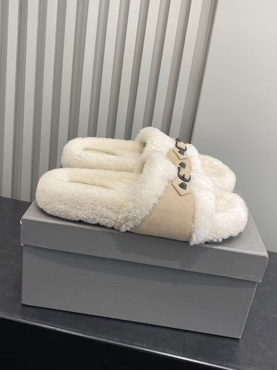 Fuzzy slide sandals, cream sherpa with tan strap and black buckle detail