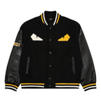 Black long-sleeve varsity jacket with snap front, yellow/white striped cuffs and collar