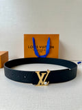 Dark leather belt with embossed monogram and gold-tone LV buckle on flat lay.