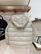 Long puffer jacket in light beige with hooded back and quilted stripe baffles