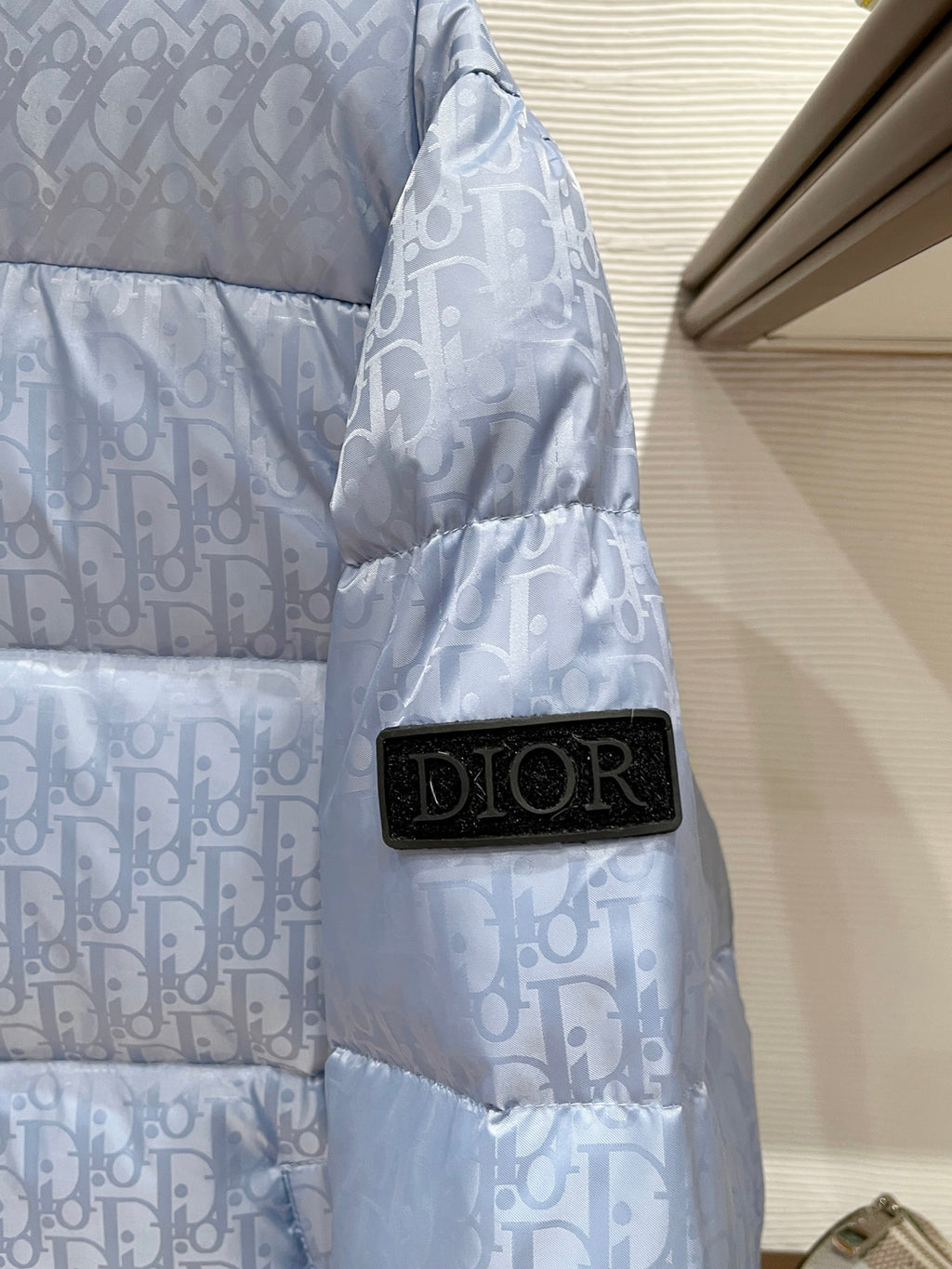 Dior long puffer jacket, light blue monogram sleeve with black Dior patch