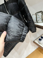 Black puffer jacket sleeve with allover logo pattern and elastic cuff
