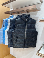 Dark quilted puffer vest with stand collar and front zipper on rack