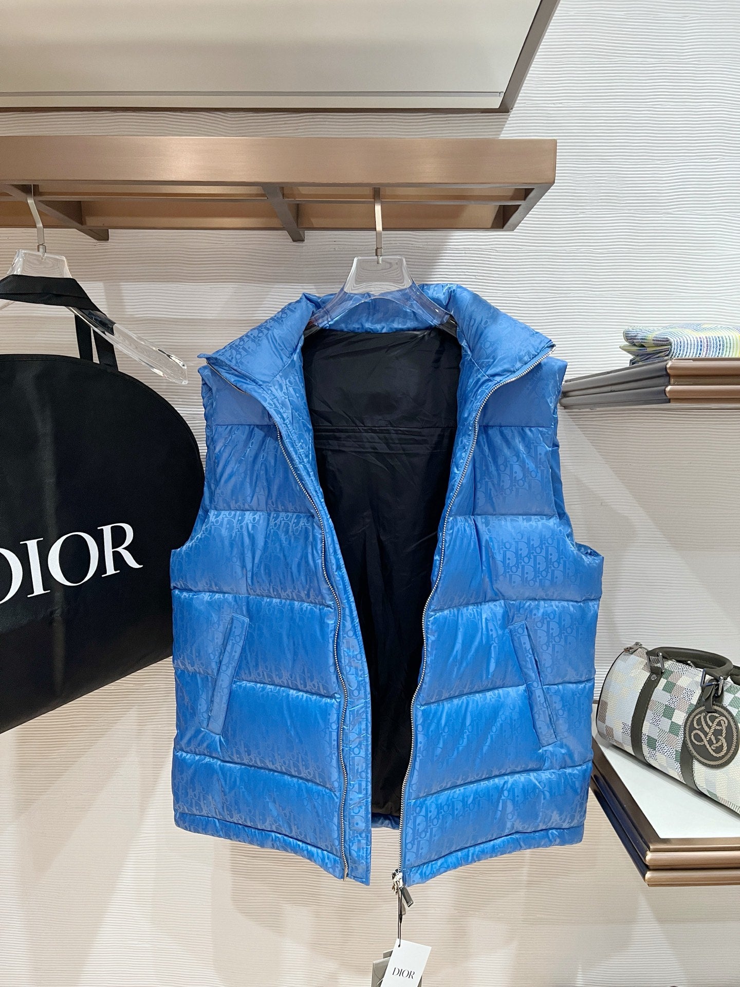 Blue quilted puffer vest with stand collar and full front zipper
