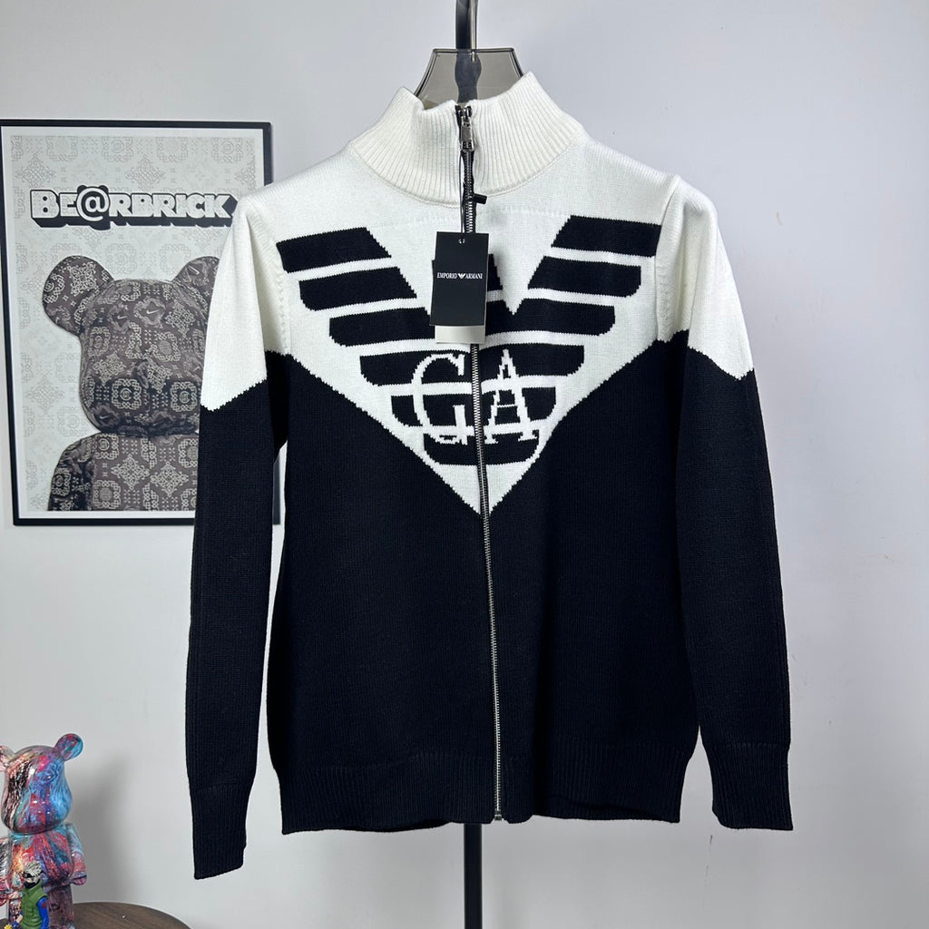 Two-tone knit zip-up sweater with ribbed turtleneck and bold logo graphic on chest