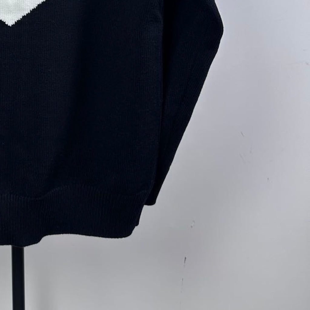 Navy knit zip-up sweater torso with fine ribbed texture and zip opening edge