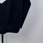 Navy knit zip-up sweater torso with fine ribbed texture and zip opening edge