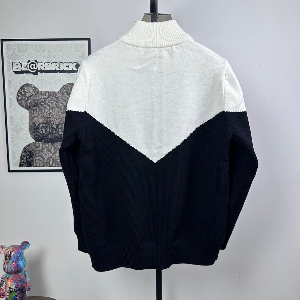 Two-tone knit zip-up sweater with ribbed turtleneck and large back logo triangle