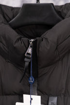 Long black puffer jacket front zipper pull with Moncler hang tag