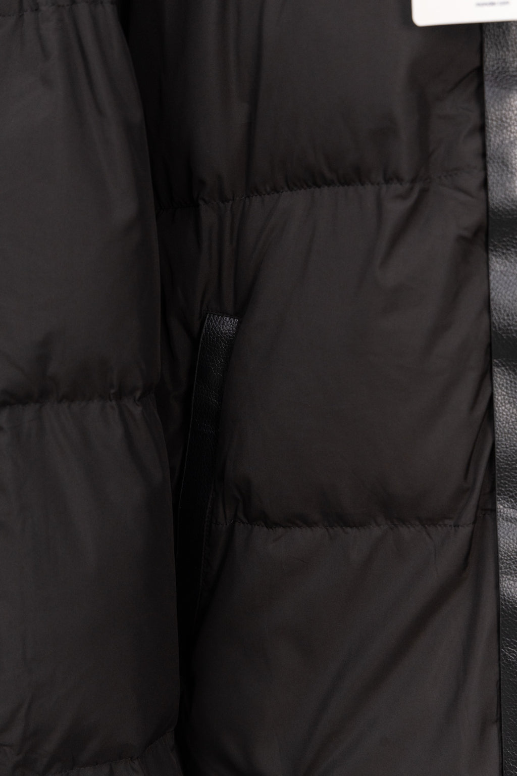 Long black puffer jacket quilted panels and buttoned placket