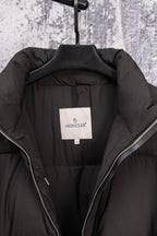 Long black puffer jacket lining with size label and zip edges