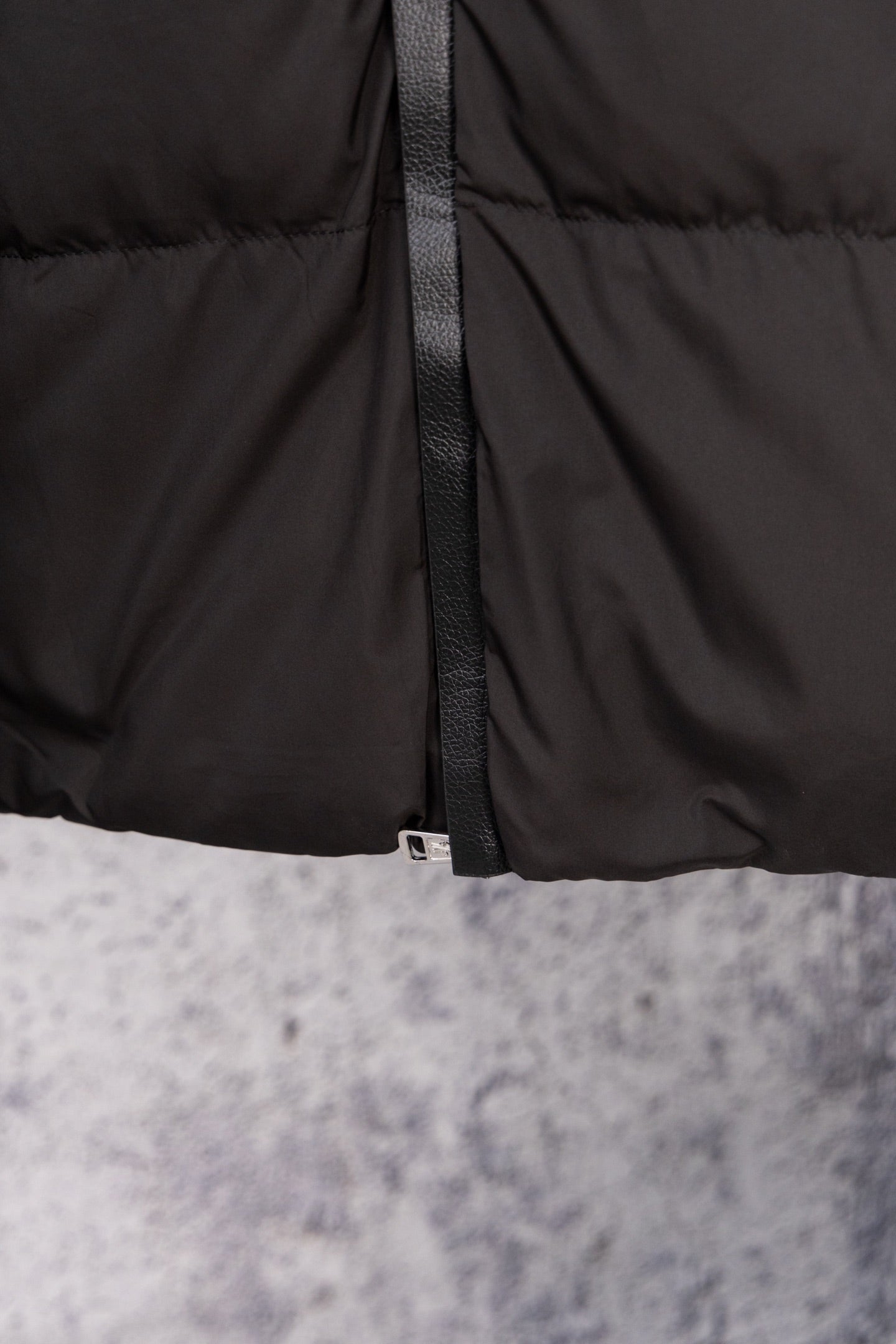 Long black puffer jacket front zipper with textured trim