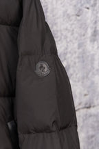 Black long puffer jacket sleeve with Moncler crest logo patch