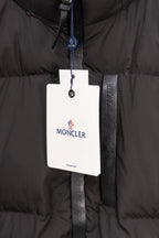 Long black puffer jacket with Moncler logo hanging tag