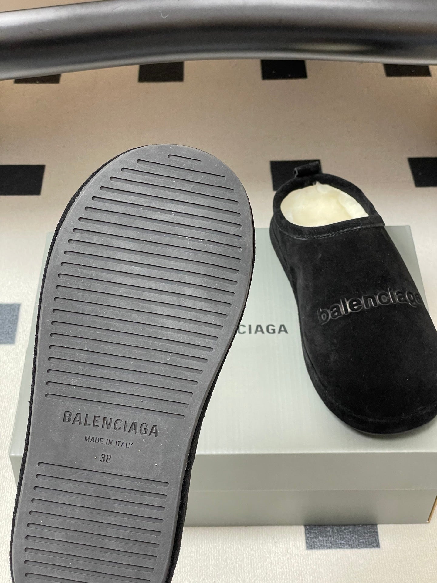 Balenciaga black suede slide sandals with textured rubber sole and side logo