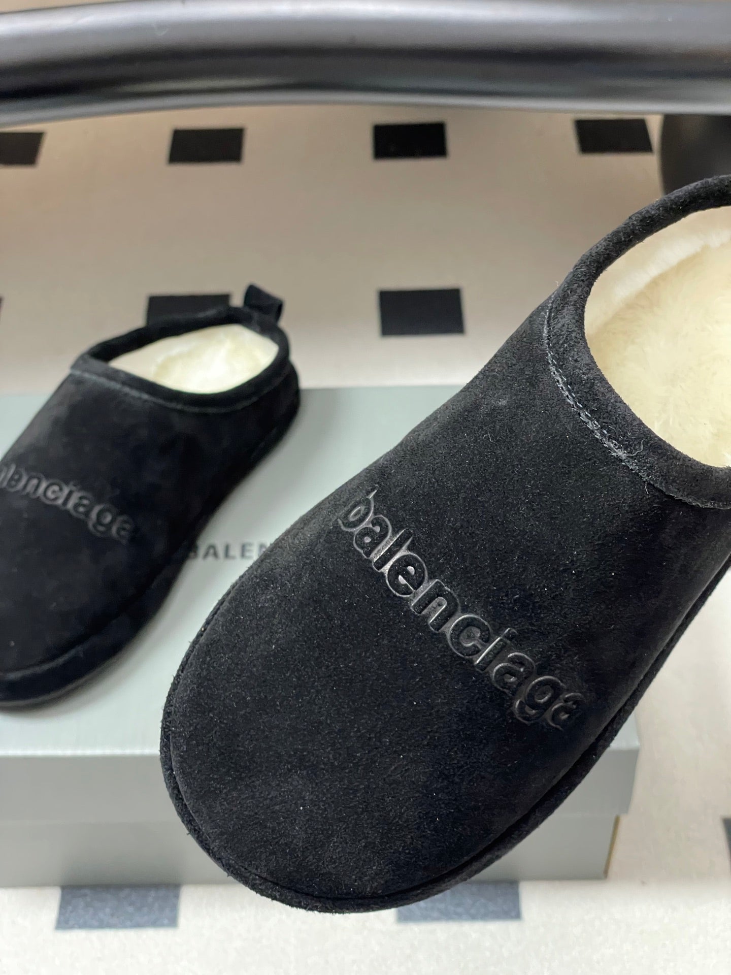 Balenciaga black suede slide sandals with embossed balenciaga logo on upper
